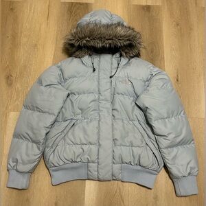 The Northface 550 goose down puffer jacket with a faux fur - lined hood